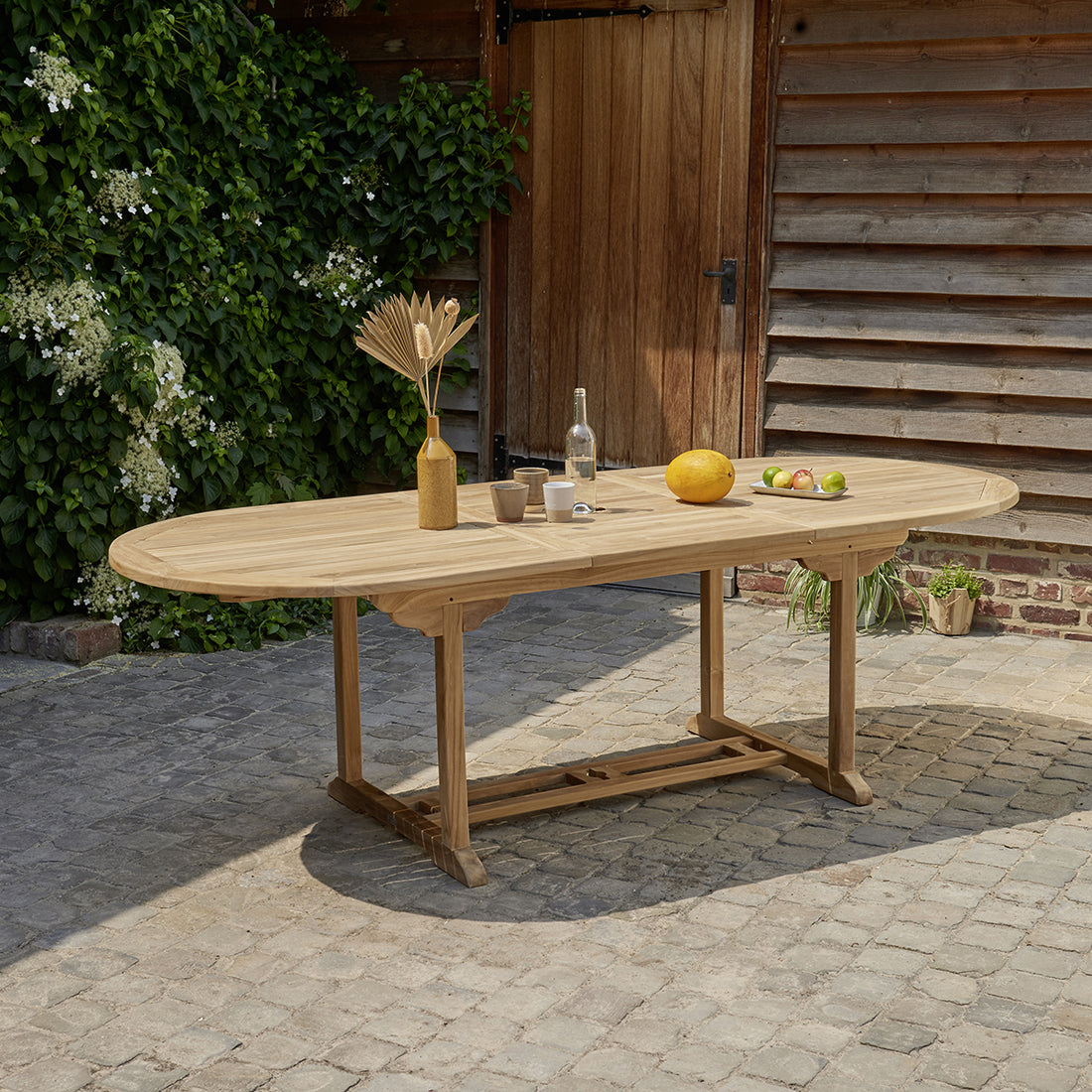 MIDLAND - Tavolo da giardino ovale allungabile in teak massello per 8/10 persone.